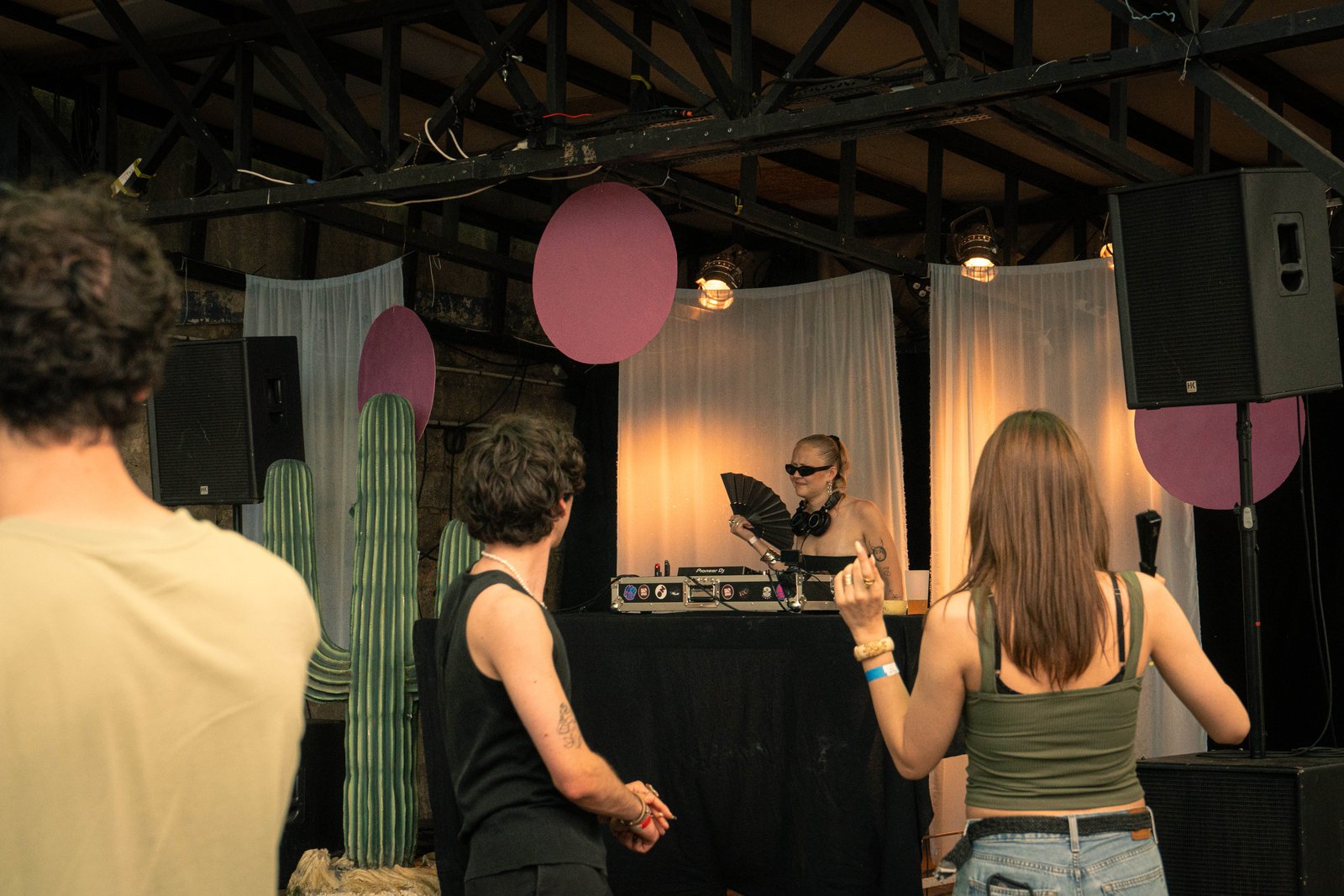 Guests dancing in front of the booth in the late-afternoon light